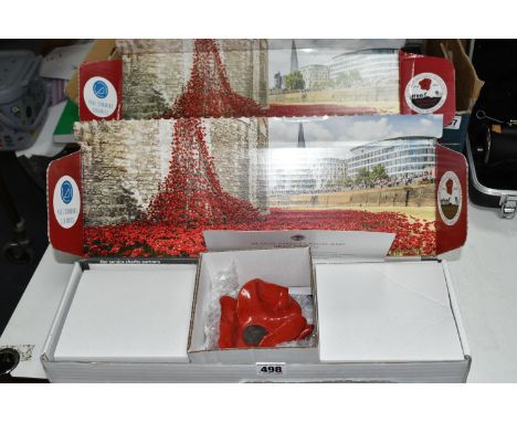 TWO BOXED LIMITED EDITION CERAMIC POPPIES BY PAUL CUMMINS, comprising one with a certificate, one of 888,246 poppies issued a