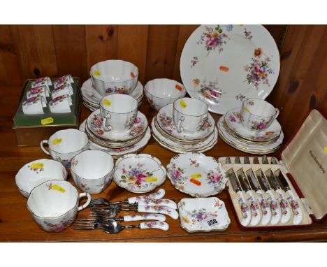 A GROUP OF ROYAL CROWN DERBY TEA WARES comprising six tea cups, ten saucers, eight side plates, seven dessert plates, two sug