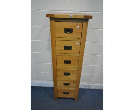 A MODERN LIGHT OAK TALL SLIM CHEST OF SIX DRAWERS, width 50cm x depth 36cm x height 150cm (condition report: overall good con