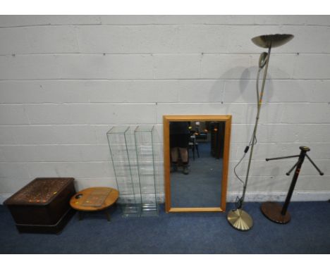 A RECTANGULAR PINE WALL MIRROR, 119cm x 73cm, two glass cabinets, a standard lamp, a towel rail, a small table, and a commode