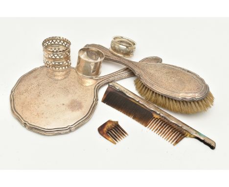 A SELECTION OF SILVERWARE, to include three napkin rings, a hairbrush, a handheld mirror and an AF comb, all with British hal