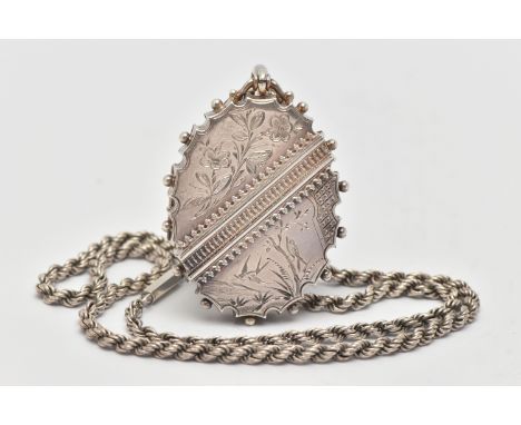 A MID VICTORIAN SILVER LOCKET, the oval shape locket with scalloped and bead detail to the edge, engraved floral and bird dec