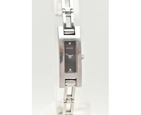 A LADIES 'GUCCI' WRISTWATCH, quartz movement, rectangular black dial signed 'Gucci', stainless steel case, approximate case d