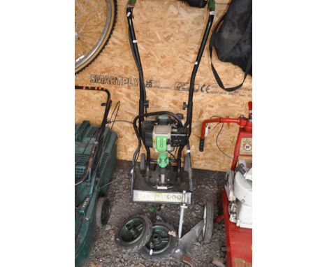 A HANDY THPMT PETROL TILLER with detached wheels and furrow (engine pulls freely but hasn't been started)