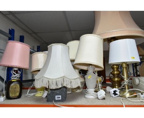 A GROUP OF NINE TABLE LAMPS to include one hand cut stone lamp, an Old Parr whiskey bottle lamp with stickers, one white onyx