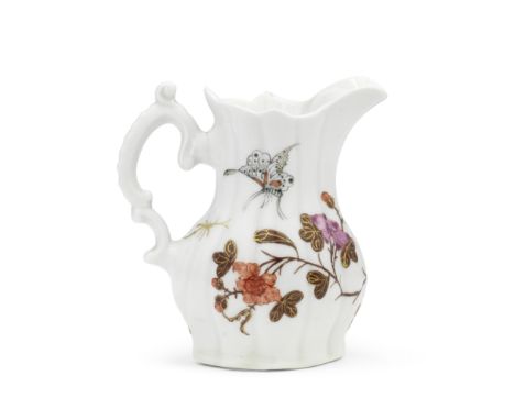 A rare Worcester creamjug, circa 1756Of finely lobed press-moulded form, the double C-scroll handle with a curled thumbrest, 
