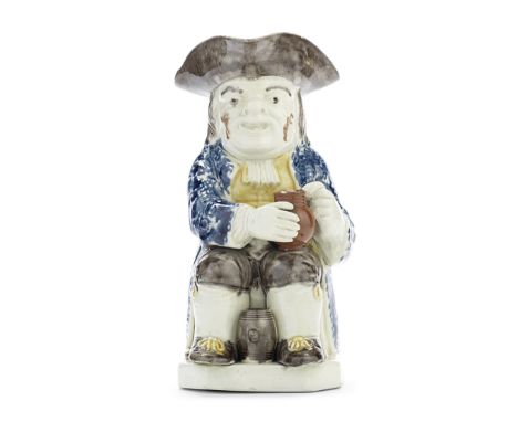 A Wood Family Toby Jug, circa 1790Of traditional form, seated and with a small barrel resting between his feet and a pipe at 