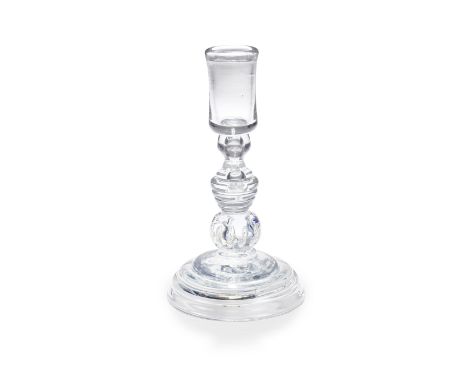 A good heavy baluster candlestick, circa 1720-30The large cylindrical nozzle with a folded rim, set on a shoulder knop contai