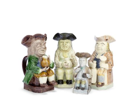 Four Toby Jugs in traditional style, probably 19th centuryComprising a curious example inspired by the glazes of the Wood Fam