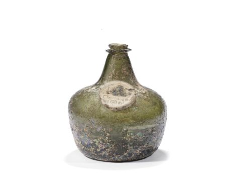 An important and early sealed wine bottle, dated 1683Of 'Onion' form in pale green glass, the large shouldered body with tape