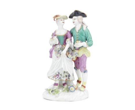 A Derby group of Lovers, circa 1762The lady and gentleman standing arm in arm and holding between them a garland of flowers m