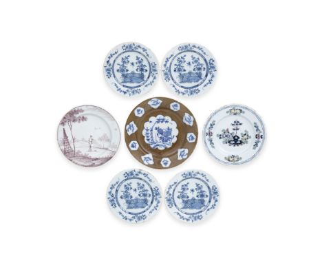 A collection of seven English delftware plates, 18th centuryComprising a rare large plate with multiple panels of blue birds 