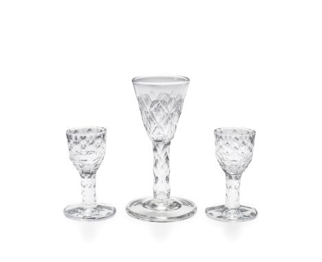 A pair of facet-stem firing or wine glasses and a large wine glass, circa 1770The pair of attractive small size, with faceted