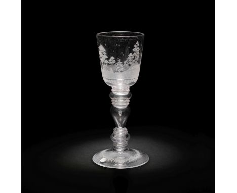 A Nuremburg engraved goblet, first quarter 18th centuryIn the manner of Johann Wolfgang Schmidt, the round funnel bowl wheel-