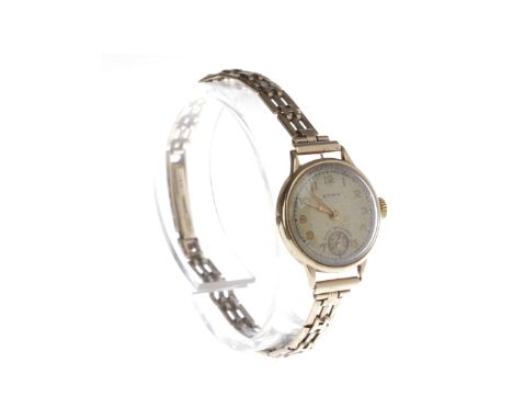 LADY'S EARLY TWENTIETH CENTURY CYMA NNE CARAT GOLD MANUAL WIND WRIST WATCHthe round dial with Arabic numerals in gold, subsid