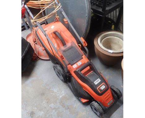 Black and Decker 1400w EDrive electric lawn mower. Not available for in-house P&P, contact Paul O'Hea at Mailboxes on 01925 6