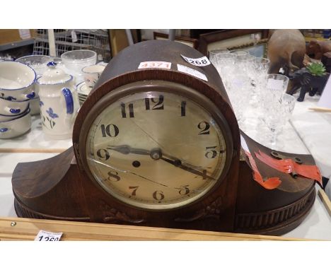 Oak cased mantel clock, H: 30 cm. Glass damaged, ticks then stops. Not available for in-house P&amp;P, contact Paul O'Hea at 