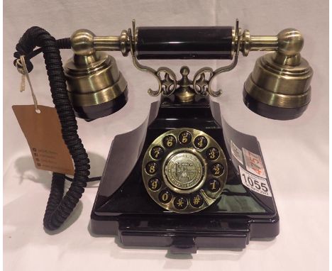 The Duke is a push button telephone with a black &amp; brass finish and traditional cloth handset curly cord. Compatible with