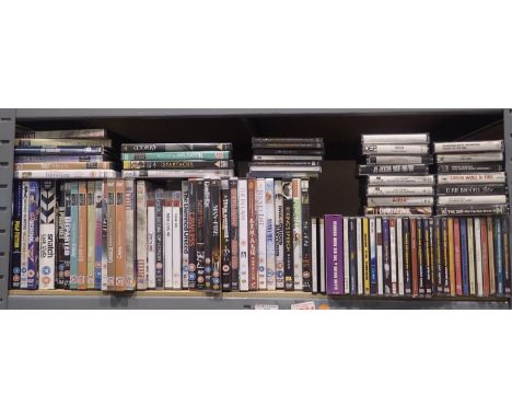 Shelf of DVDs, CDs and cassettes. Not available for in-house P&amp;P, contact Paul O'Hea at Mailboxes on 01925 659133 