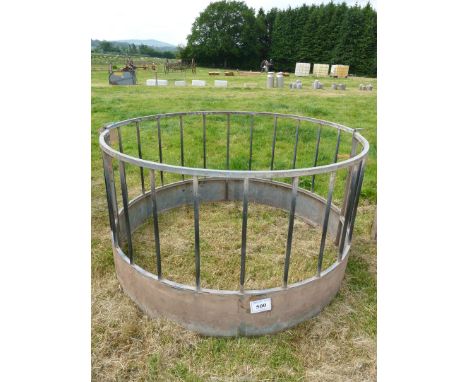 A galvanised sheep ring Feeder, 1.6 metres diameter x 0.87 metres high.
