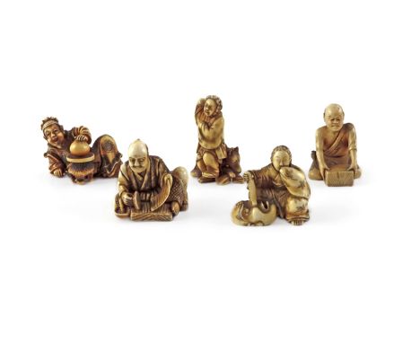 FIVE JAPANESE IVORY NETSUKE MEIJI 1868-1912 Variously carved as figures, one dancing with a dog behind him, another a thwarte