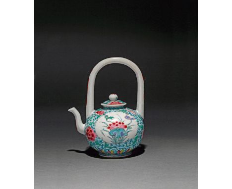 A CHINESE FAMILLE ROSE WINE POT AND COVER FOUR CHARACTER YONGZHENG MARK AND OF THE PERIOD 1723-35 Brightly enamelled with two