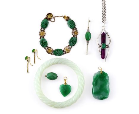 A SMALL COLLECTION OF CHINESE JEWELLERY 20TH CENTURY Comprising: a jadeite heart-shaped pendant, a jadeite cabochon mounted a