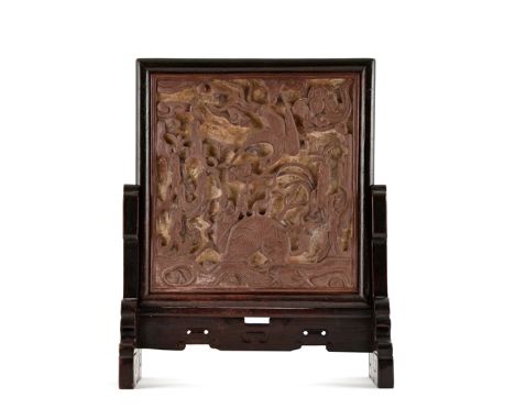 A QIYANG STONE TABLE SCREEN, MING DYNASTY Carved in relief with a kylin and a phoenix in flight above, with a smaller bird pe