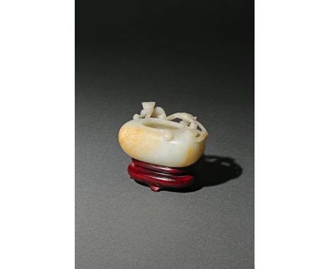 A CHINESE PALE CELADON JADE OVAL BRUSH WASHER, 18TH/19TH CENTURY The plain elongated ovoid body carved with a single sinuous 