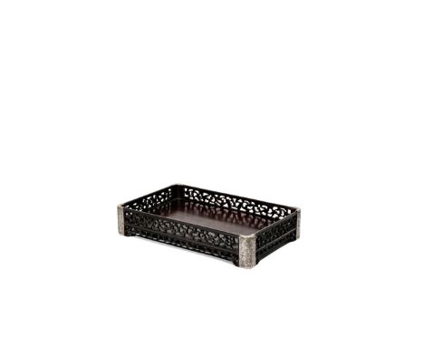 A CHINESE ZITAN TRAY, LATE QING DYNASTY The rectangular base framed by shallow openwork sides, carved with a continuous scrol