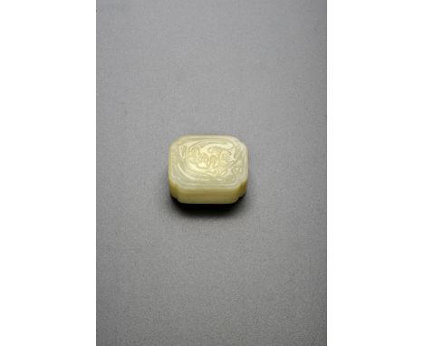 A SMALL CHINESE PALE CELADON JADE RECTANGULAR BOX AND COVER 18TH/19TH CENTURY Of quatrefoil form, the cover carved in shallow