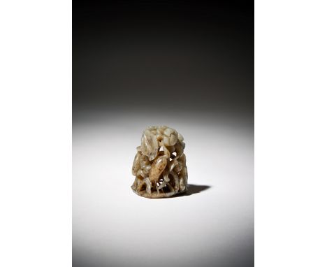 A SMALL CHINESE PALE CELADON JADE HAT FINIAL, MING DYNASTY The openwork finial carved with five aquatic birds amongst large l