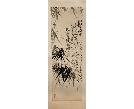 A CHINESE SCROLL PAINTING ON SILK 19TH/20TH CENTURY Depicting bamboo and calligraphy, with two red seal marks, 82cm x 27cm.