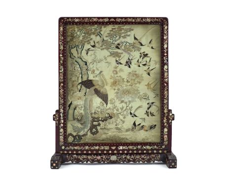 A CHINESE STANDING SCREEN 19TH CENTURY The hardwood frame inlaid with mother of pearl, enclosing an embroidered silk panel de