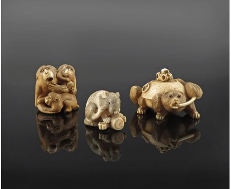 THREE JAPANESE IVORY NETSUKE MEIJI 1868-1912 The first depicting a rat with Daikoku's mallet, the eyes inlaid in horn and sig