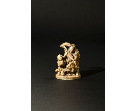 A JAPANESE IVORY OKIMONO MEIJI 1868-1912 Depicting Seiobo, the Queen Mother of the West, wearing an elaborate headdress and d