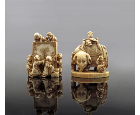 TWO JAPANESE IVORY NETSUKE MEIJI 1868-1912 The first depicting boys playing around a tsuitate (standing screen), signed Gyokk