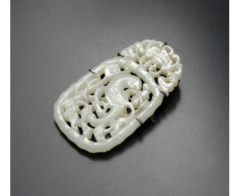 A CHINESE PALE CELADON JADE RETICULATED PLAQUE, QING DYNASTY Carved as a single long-tailed bird with two bats amongst flower