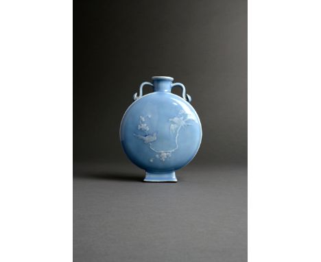 A CHINESE LAVENDER-BLUE GLAZED MOON FLASK, BIANHU, QIANLONG 1736-95 The flattened circular body slip decorated, one side with