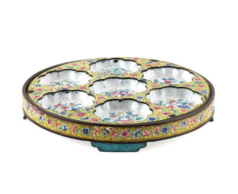 A CHINESE CANTON ENAMEL FAMILLE ROSE SWEETMEAT TRAY 19TH CENTURY With seven lobed dishes, each decorated with flowering and f