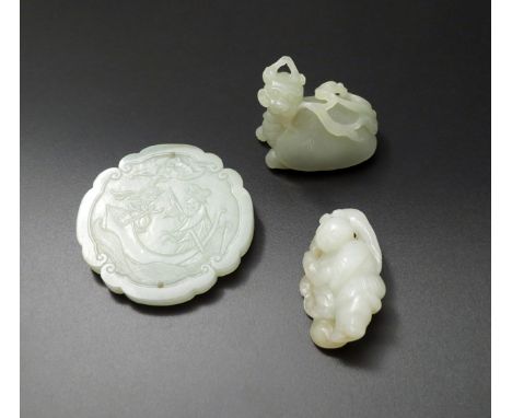 THREE CHINESE PALE CELADON JADE CARVINGS, 18TH AND 19TH CENTURIES One a quatrefoil bracket button pendant, carved in shallow 