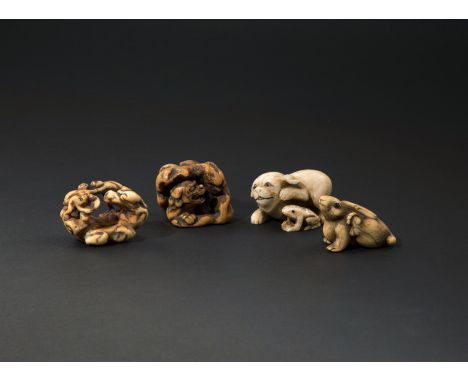 FOUR JAPANESE IVORY NETSUKE 18TH/19TH CENTURY Variously carved as five monkeys wrestling, a hare with inlaid horn eyes, a shi