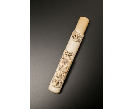 A JAPANESE IVORY KISERUZUTSU MEIJI 1868-1912 The pipe case of musozutsu form carved in high relief with Shoki the demon quell