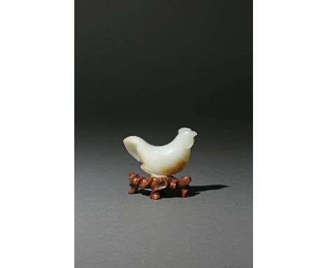 A CHINESE PALE CELADON JADE CARVING OF A COCKEREL, 18TH CENTURY The bird in a crouched position, his head slightly turned to 