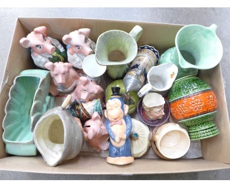 Assorted china including Royal Doulton, Wade Nat West pigs, Goebel, West German vases, face pots, etc., one money bank a/f 