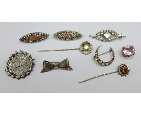 Two hallmarked Victorian silver and gilt fronted brooches, four other brooches, two stick pins and a stone set stud, all test