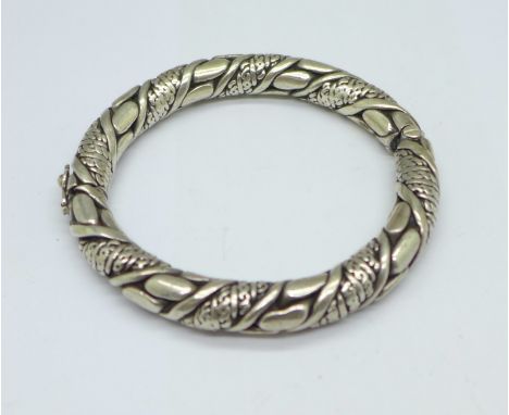 A white metal ornate bangle, locking mechanism a/f, 126g 