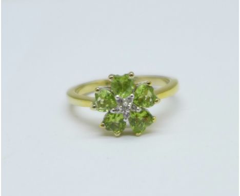 A silver gilt, peridot and diamond cluster ring, (GEMS TV), P 