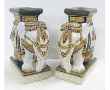 Two ceramic elephant stands 
