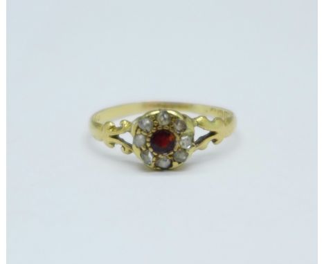 An 18ct gold old cut diamond and garnet cluster ring, 2.0g, R 